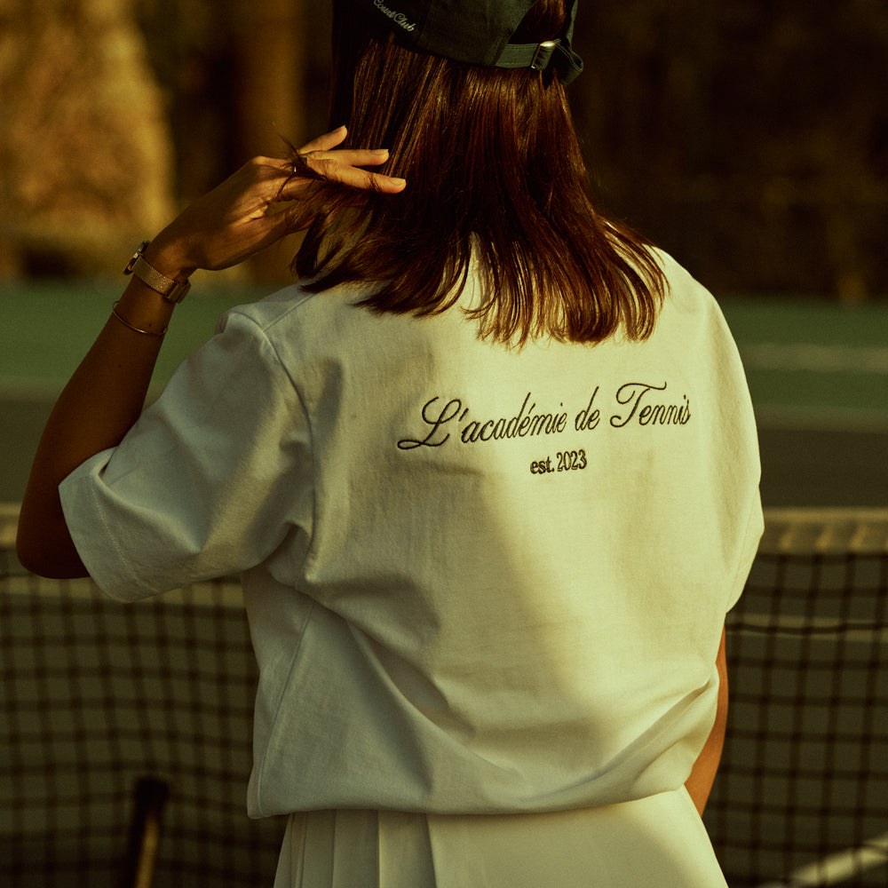 
                      
                        L'academie de Tennis Shirt White
                      
                    